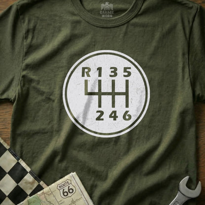 T-shirt with a white circle graphic of a manual car gear shift pattern.