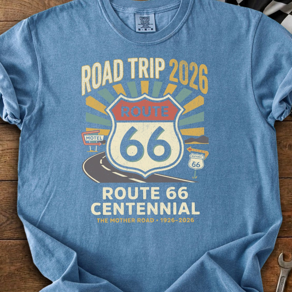 Blue t-shirt with "Road Trip 2026 Route 66 Centennial" graphic.