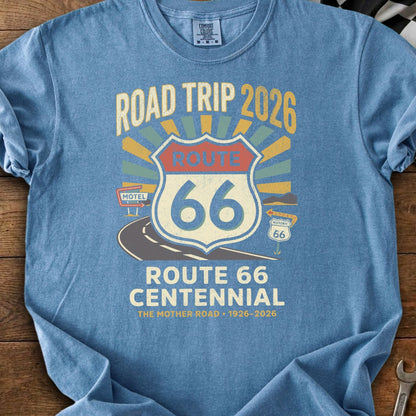 Blue t-shirt with "Road Trip 2026 Route 66 Centennial" graphic.