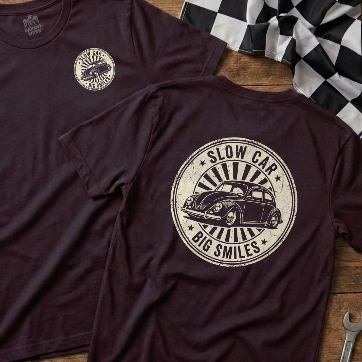 Dark t-shirt with circular "Slow Car Big Smiles" graphic featuring a vintage Volkswagen Beetle.