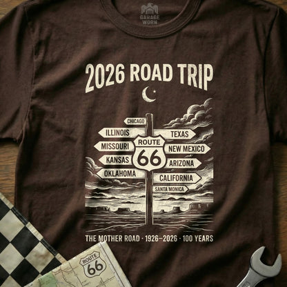 Brown t-shirt with "2026 Road Trip" and Route 66 signpost.