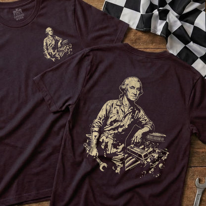 George Washington in mechanic's uniform with engine and tools, on t-shirt.