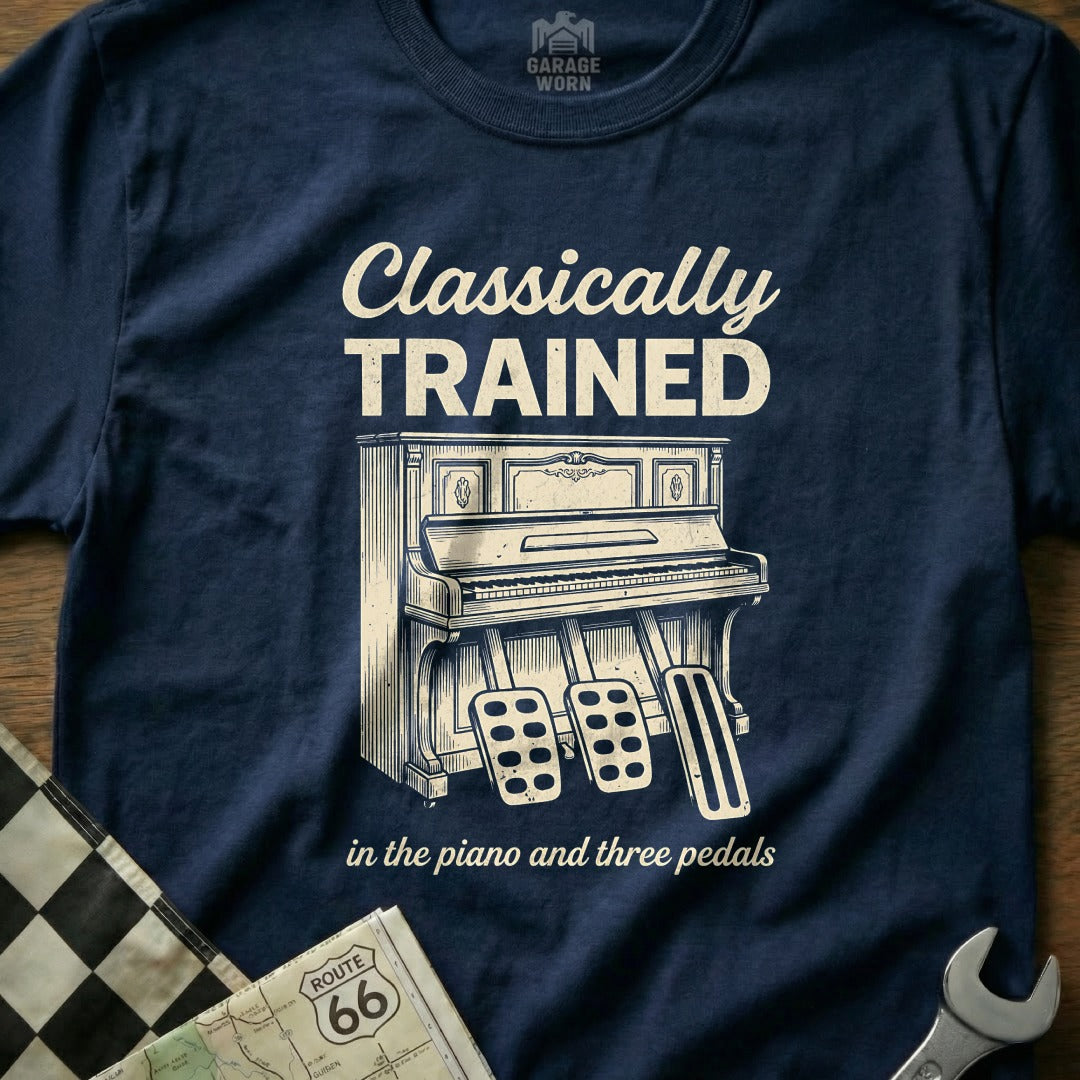 Navy t-shirt with "Classically Trained" text above a piano and pedals.