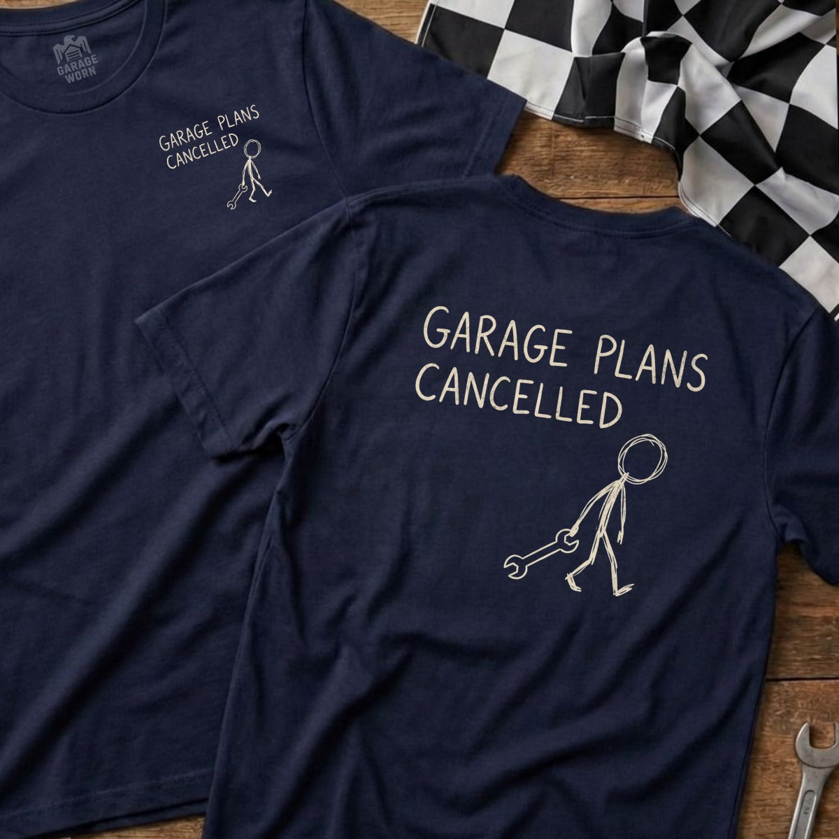 Navy t-shirt with "GARAGE PLANS CANCELLED" and stick figure with wrench.