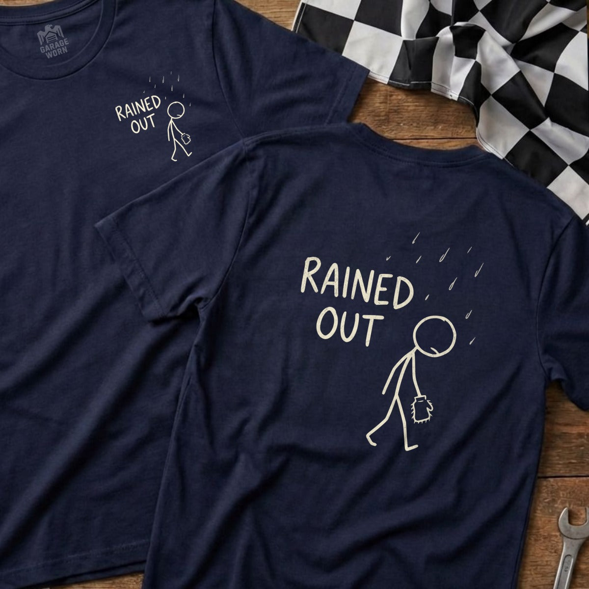 Navy t-shirts with stick figure under rain, text "RAINED OUT".