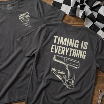 Dark gray t-shirt with white graphic of a timing light and text "Timing Is Everything."