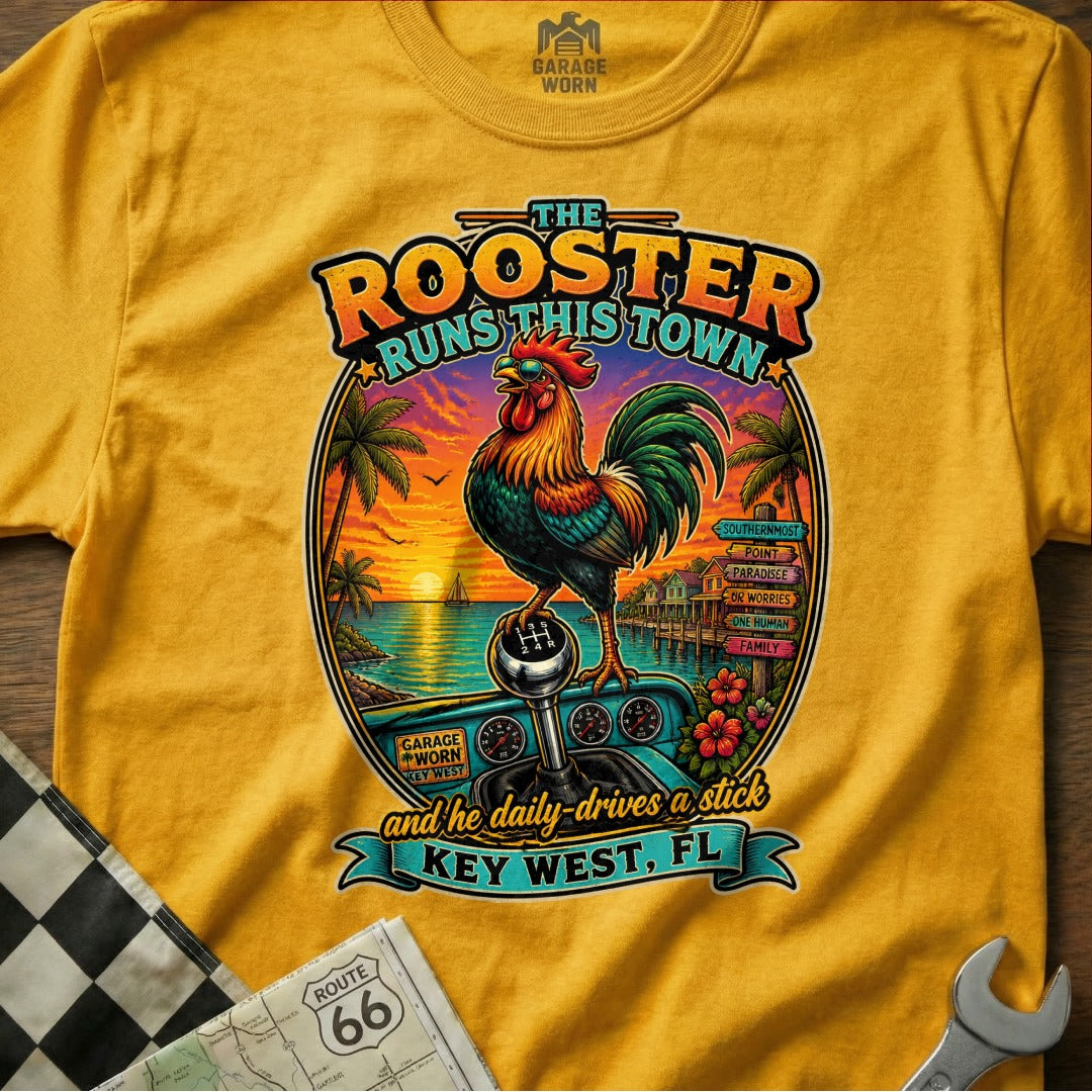 Yellow t-shirt with a rooster, gear shift, and Key West scene. "The Rooster Runs This Town" and "Key West, FL" text.