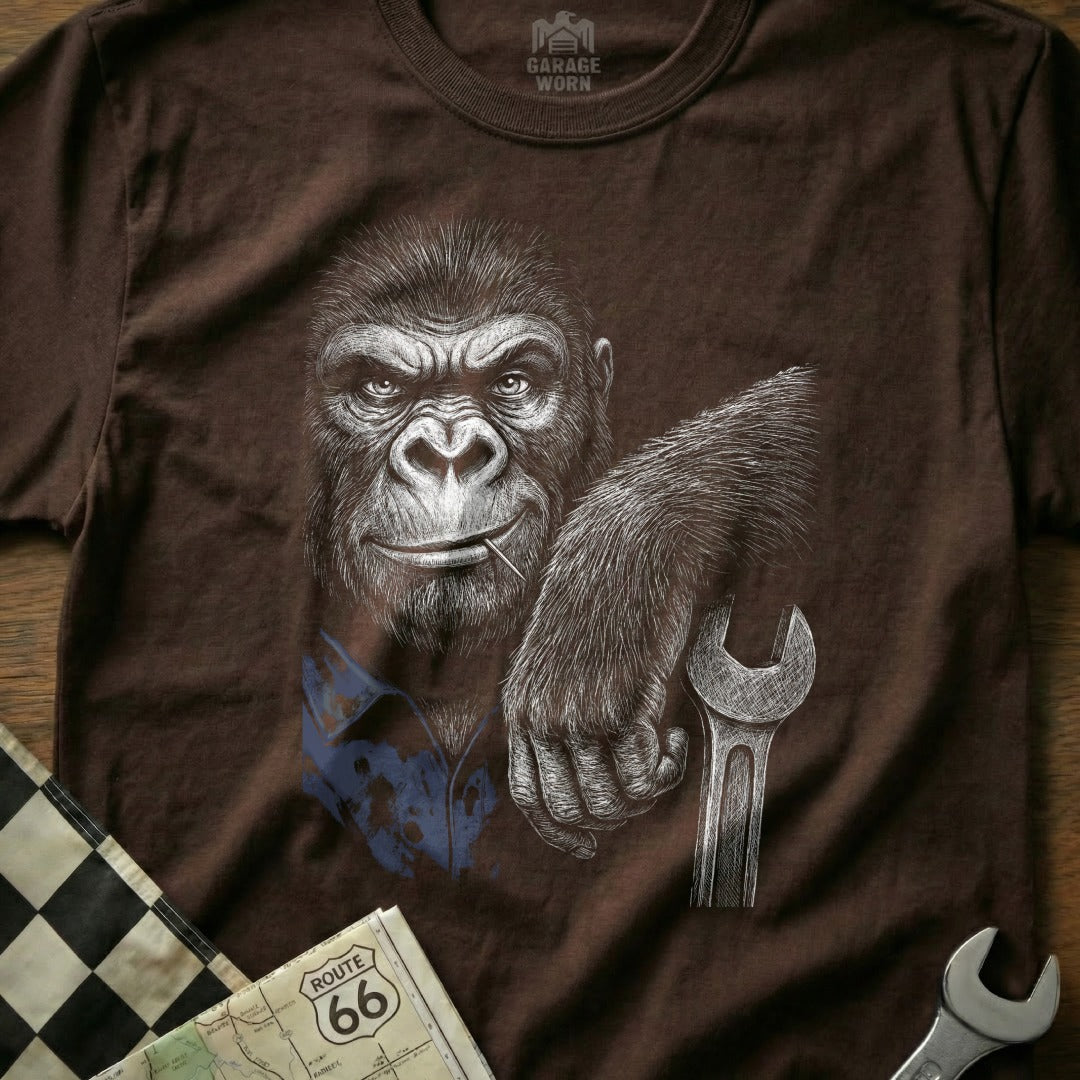Gorilla holding a wrench, wearing a blue shirt, with checkered flag and map.