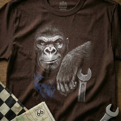 Gorilla holding a wrench, wearing a blue shirt, with checkered flag and map.