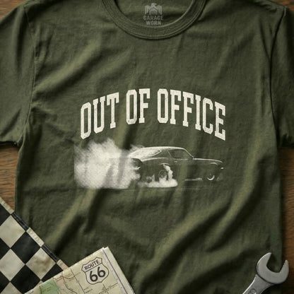Green t-shirt with "OUT OF OFFICE" text and a car doing a burnout.