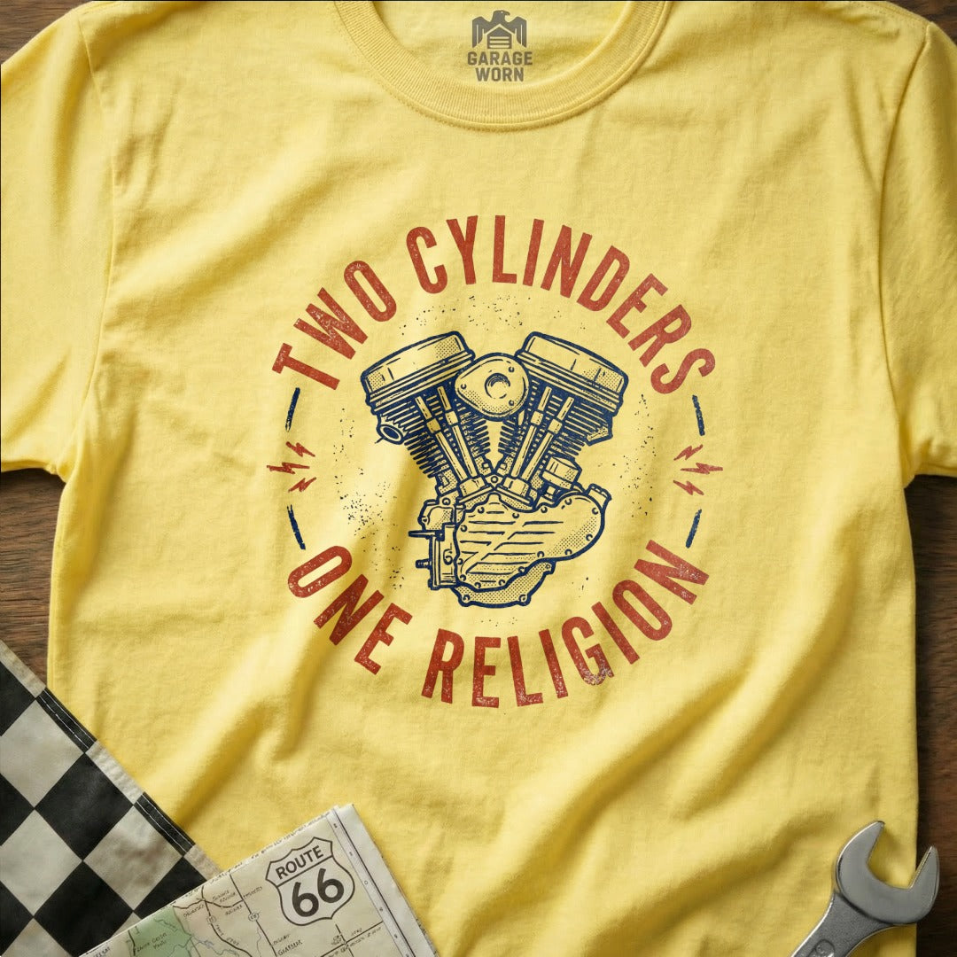 Yellow t-shirt with "TWO CYLINDERS ONE RELIGION" text and motorcycle engine graphic.