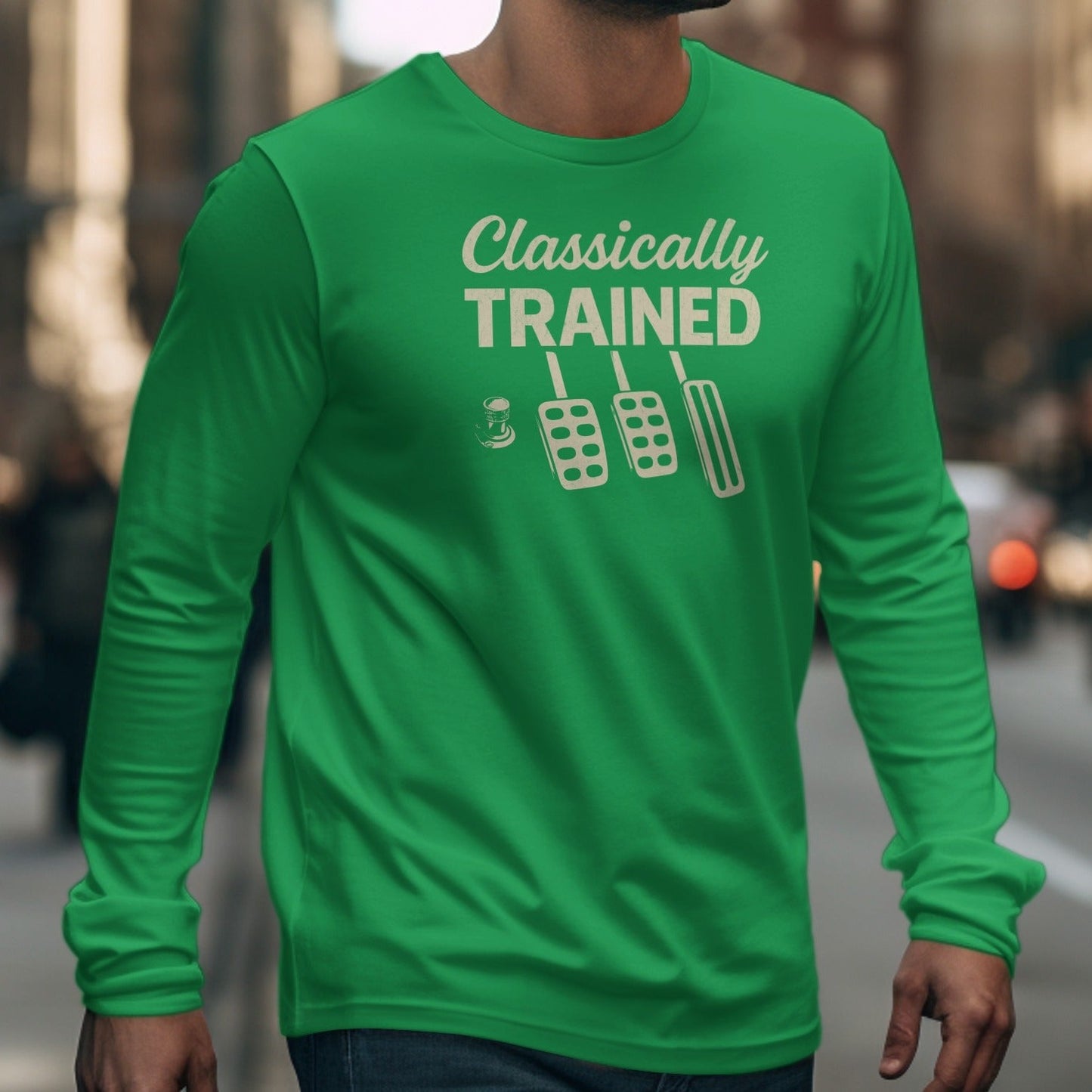 Green long-sleeve shirt with "Classically TRAINED" and car pedals design.