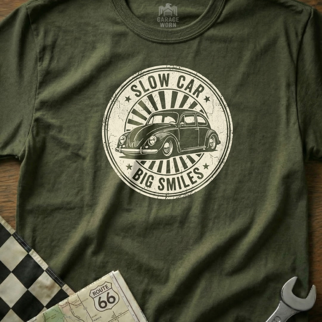Green t-shirt with "Slow Car, Big Smiles" text and vintage car graphic.