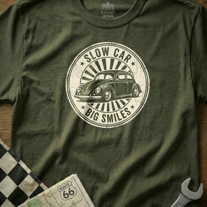 Green t-shirt with "Slow Car, Big Smiles" text and vintage car graphic.