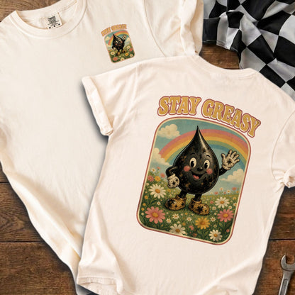 Cream t-shirt with cartoon oil drop graphic and rainbow, reads "STAY GREASY".