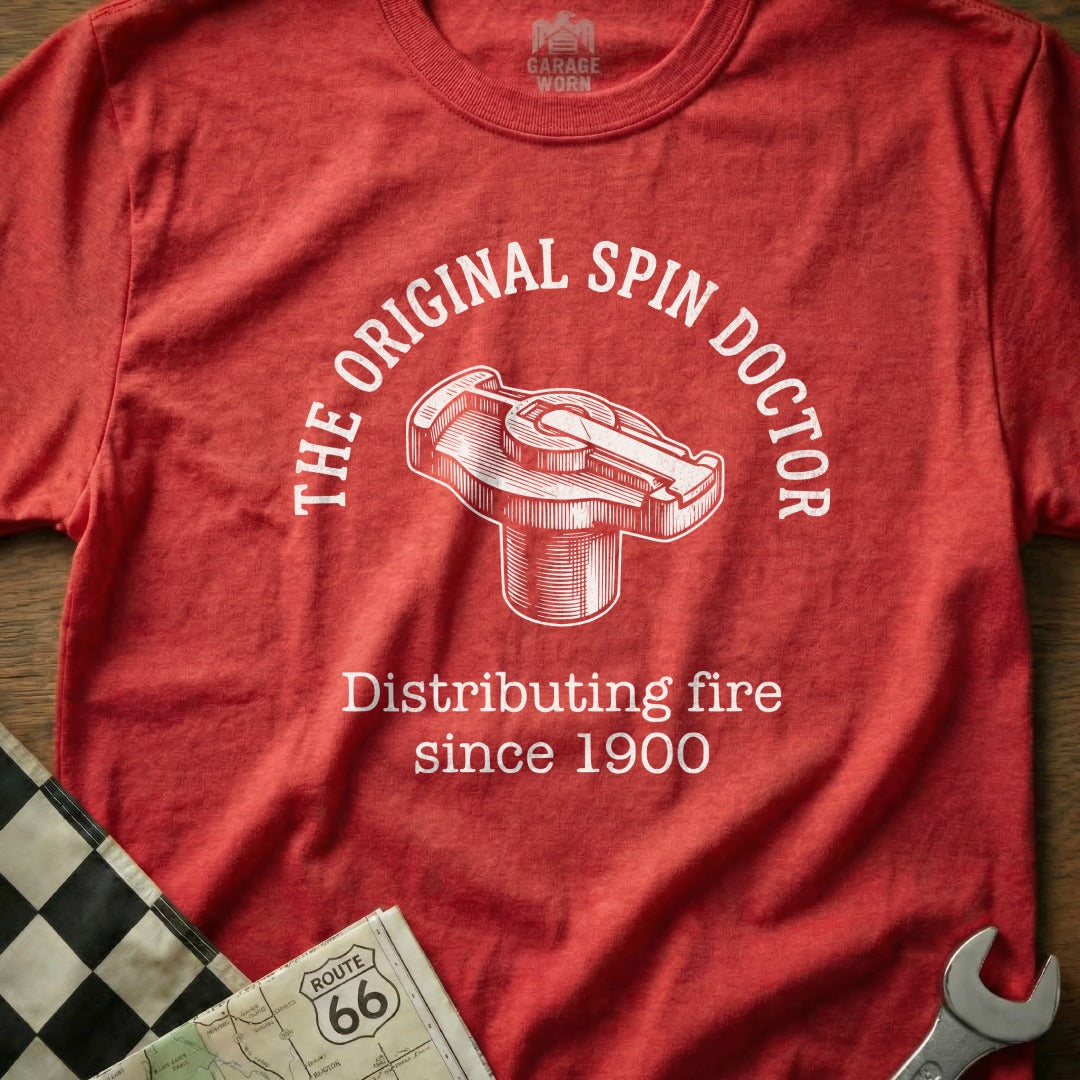 Red t-shirt with "The Original Spin Doctor" and distributor graphic.