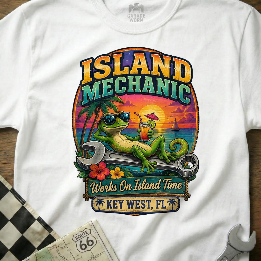 T-shirt graphic: Gecko "Island Mechanic" with wrench, sunset, and Key West, FL.