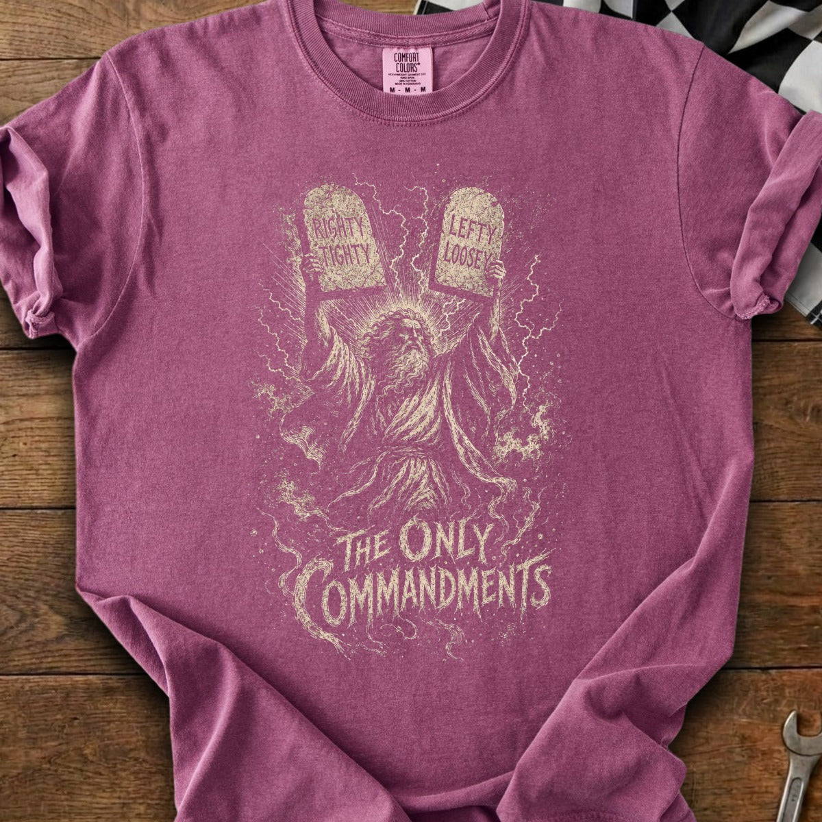 T-shirt with graphic of Moses holding tablets labeled "Righty Tighty" and "Lefty Loosey".