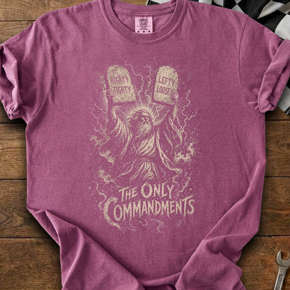 T-shirt with graphic of Moses holding tablets labeled "Righty Tighty" and "Lefty Loosey".