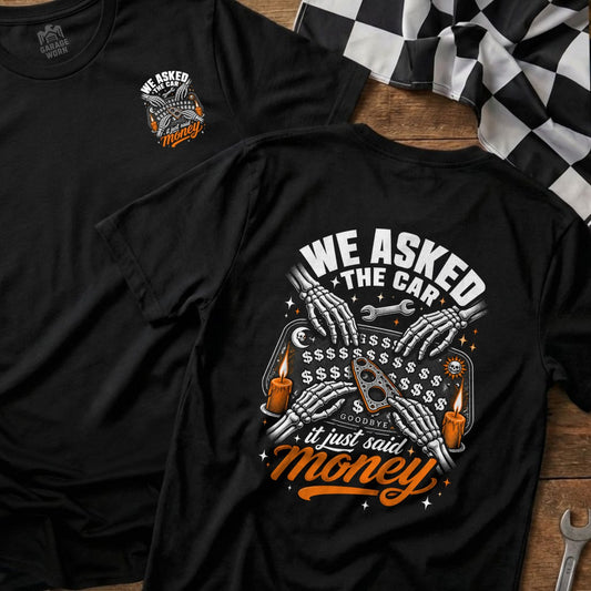 Black t-shirt with "We Asked The Car, It Just Said Money" graphic.