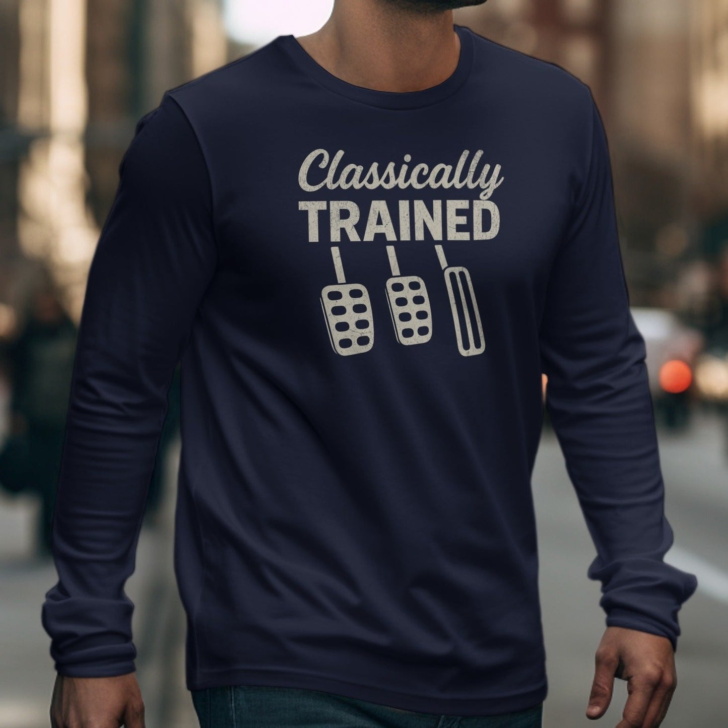 Navy long sleeve shirt with "Classically TRAINED" and a clutch pedal design.