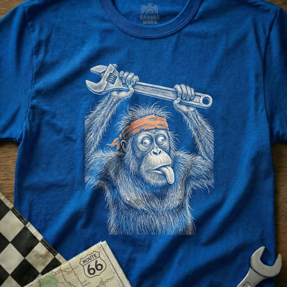 Blue t-shirt featuring a blue line drawing of an orangutan holding a wrench overhead.