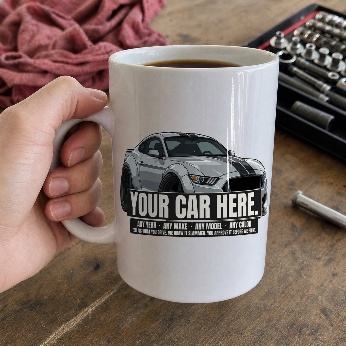 Your car here - 15 oz mug in hand over the workbench