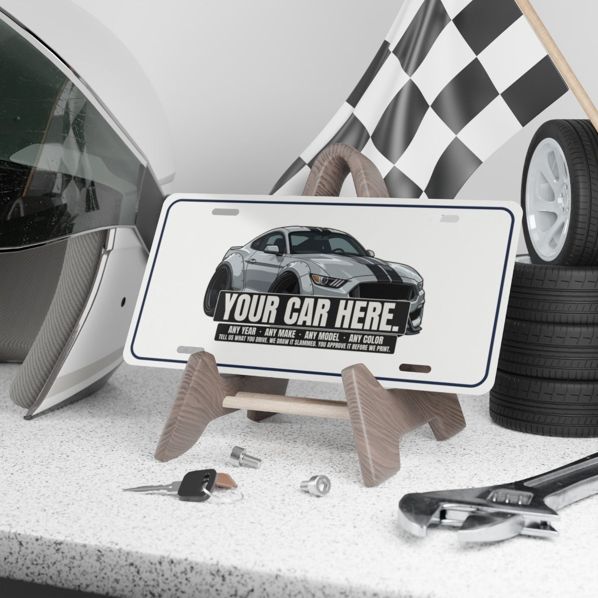 Your car here vanity plate on a garage shelf